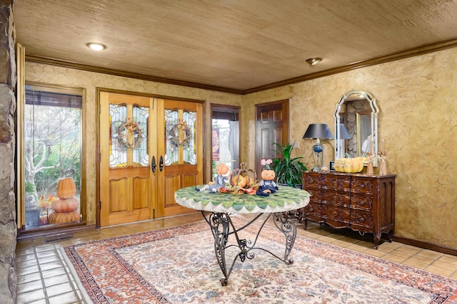 tiled entryway featuring french doors, crown molding, a healthy amount of sunlight, and wood ceiling