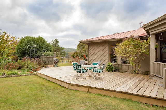 wooden terrace with a yard