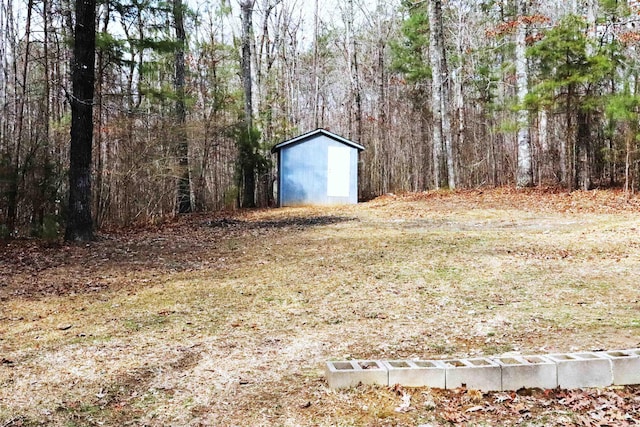  - view of yard featuring an outbuilding and a shed