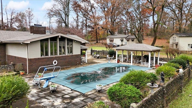 view of pool featuring a gazebo and a patio area