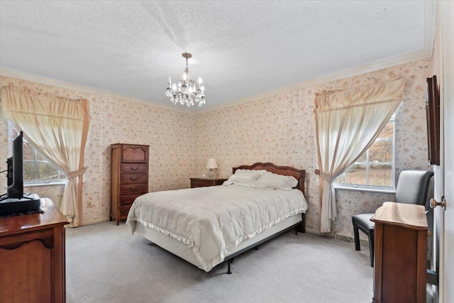 bedroom featuring crown molding, light colored carpet, a textured ceiling, and an inviting chandelier