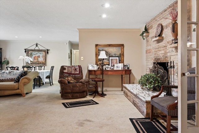 living room featuring crown molding, a fireplace, carpet, and a textured ceiling