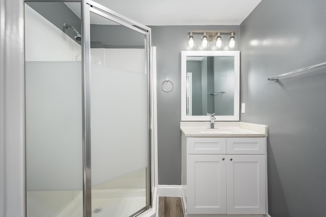  - full bathroom featuring a stall shower and vanity