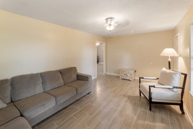 living room featuring ceiling fan