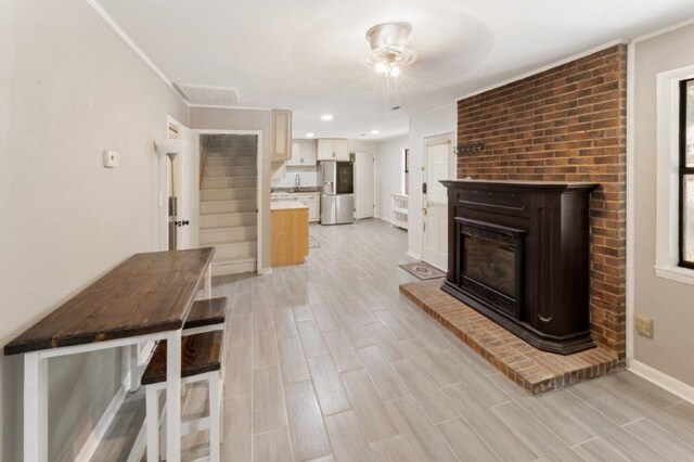 unfurnished living room with a large fireplace