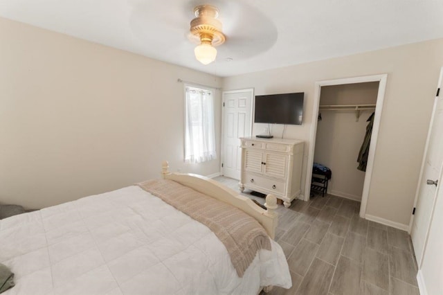 bedroom featuring ceiling fan and a closet