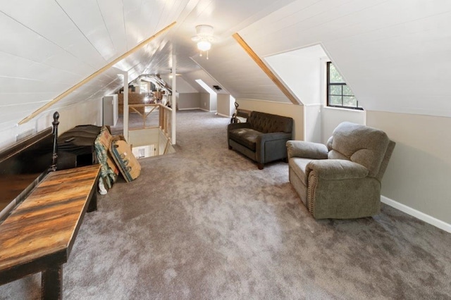 interior space featuring dark carpet and lofted ceiling