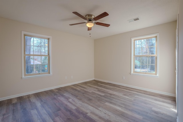 empty room featuring ceiling fan and light wood-type flooring