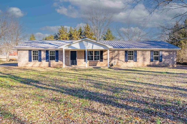 single story home with covered porch and a front lawn