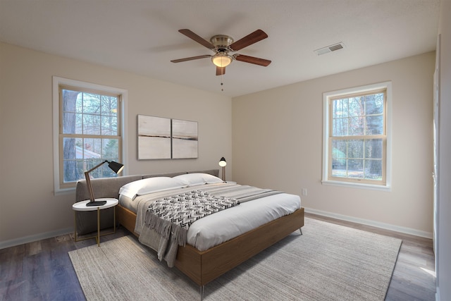 bedroom with wood-type flooring and ceiling fan