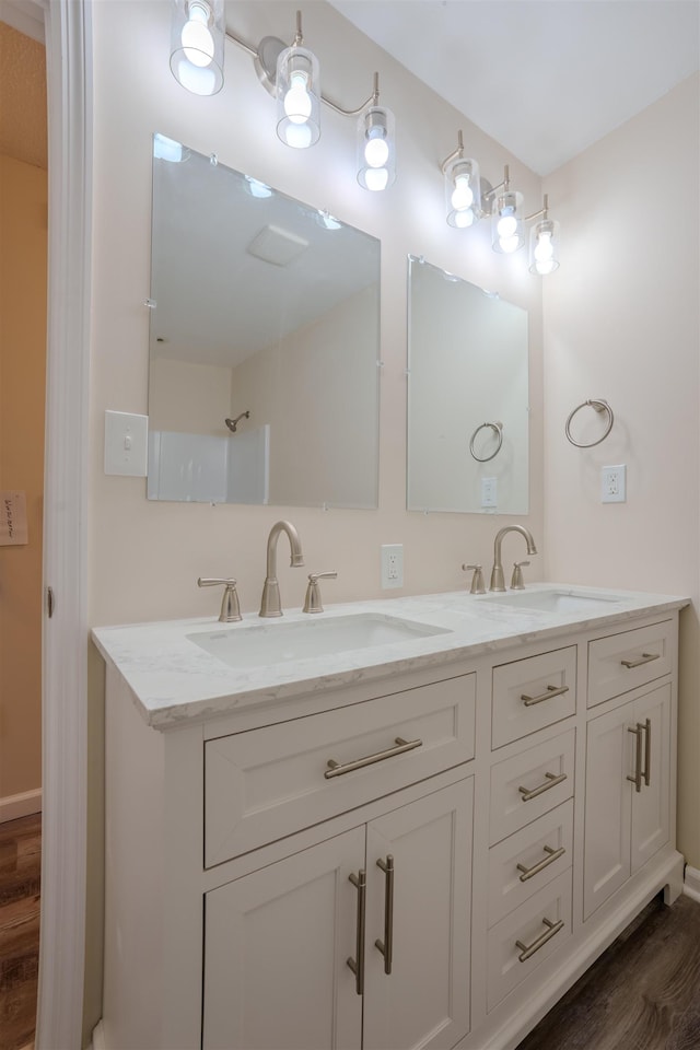 bathroom featuring vanity and wood-type flooring