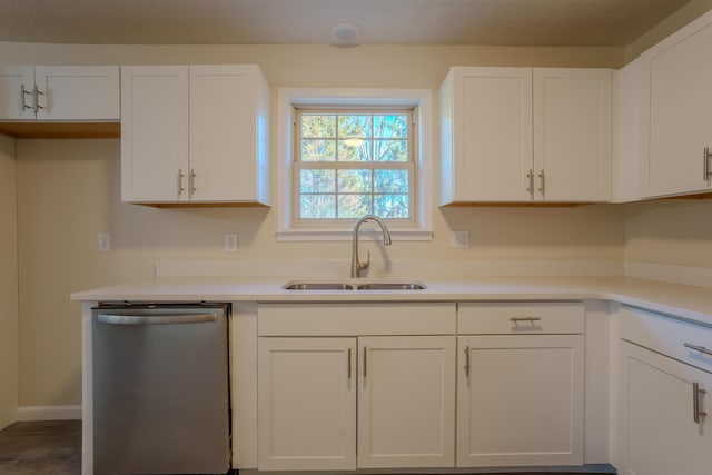 kitchen featuring white cabinetry, stainless steel dishwasher, and sink