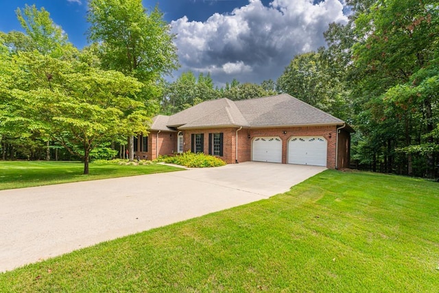 ranch-style home featuring a garage and a front lawn