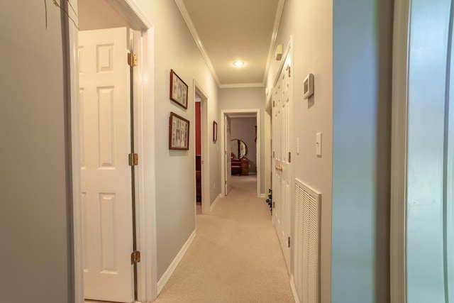 corridor featuring light colored carpet and crown molding