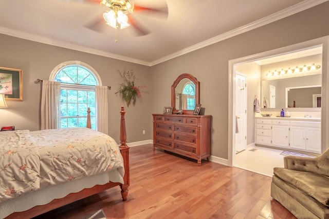 bedroom featuring ceiling fan, sink, crown molding, ensuite bathroom, and light hardwood / wood-style floors