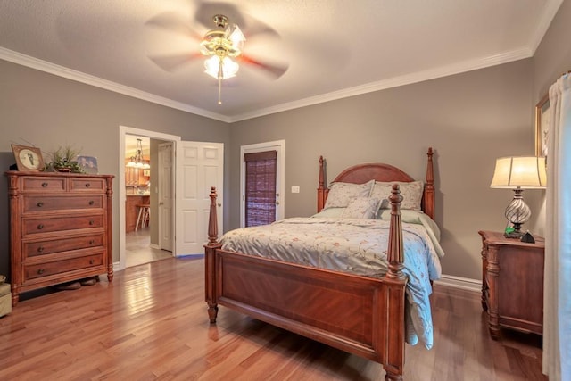 bedroom with connected bathroom, ceiling fan, crown molding, and hardwood / wood-style floors