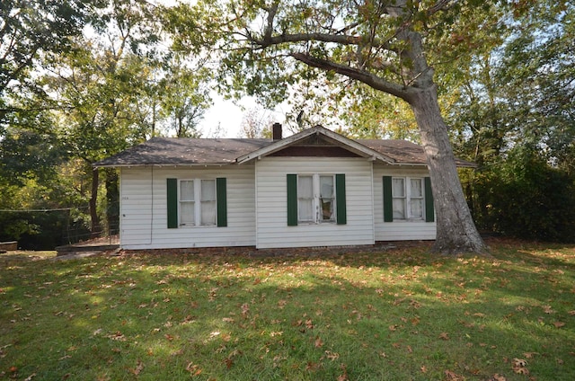 view of home's exterior with a lawn