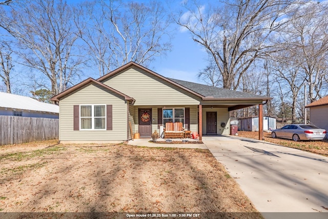 single story home with covered porch and a carport