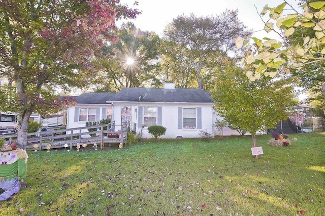 ranch-style home with a front yard