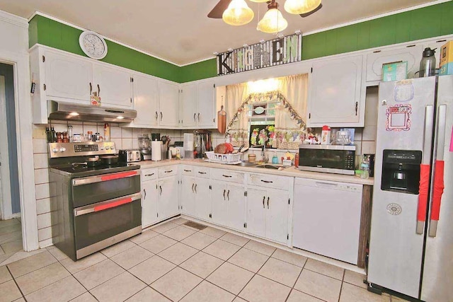 kitchen with decorative backsplash, appliances with stainless steel finishes, extractor fan, light tile patterned floors, and white cabinetry