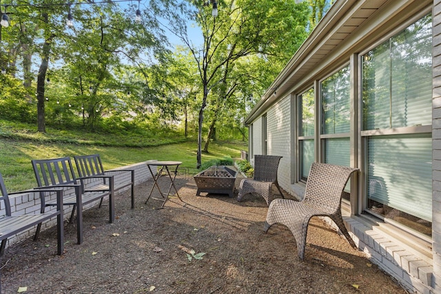 view of patio with a fire pit