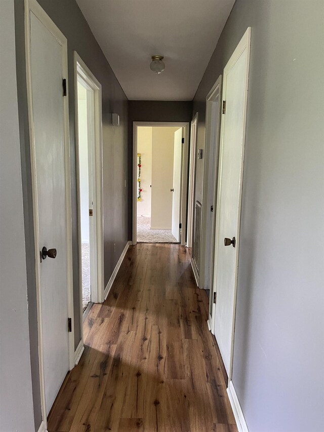  - hall with wood finished floors and baseboards