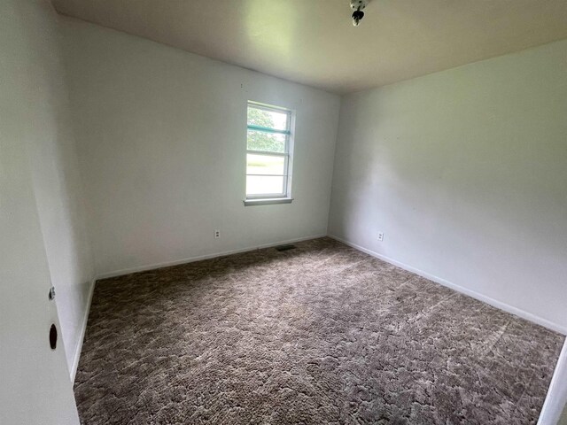  - empty room with carpet flooring and baseboards