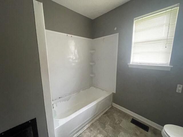  - full bathroom with baseboards and toilet