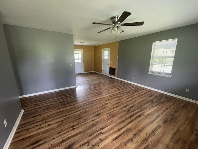  - unfurnished room featuring dark wood-style flooring, baseboards, and ceiling fan