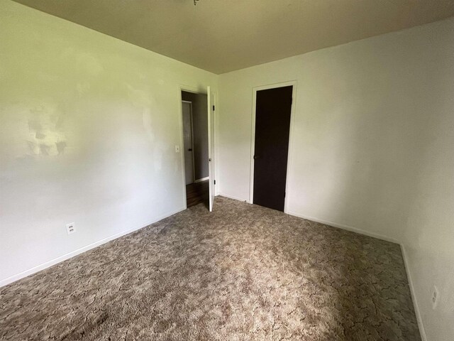  - unfurnished bedroom with carpet floors
