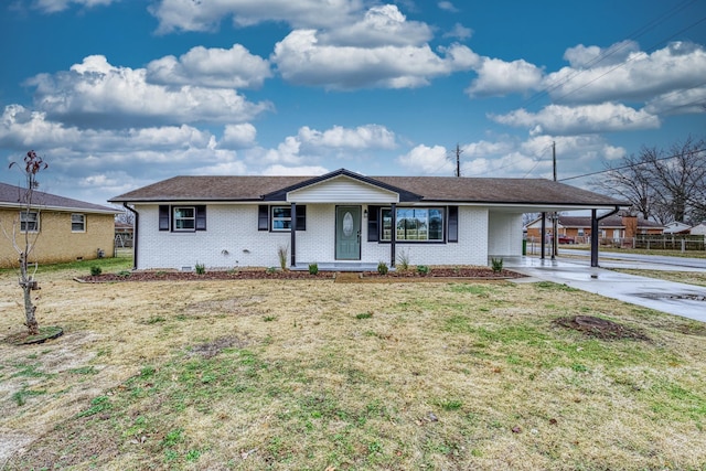 ranch-style home with a carport and a front yard