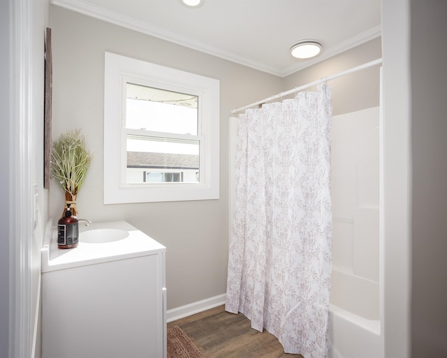 bathroom with crown molding, shower / tub combo, vanity, and hardwood / wood-style floors