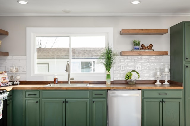 kitchen featuring crown molding, green cabinets, sink, and stainless steel dishwasher