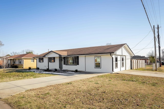 ranch-style house with a front lawn