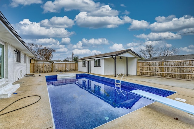 view of pool with an outdoor structure and a patio