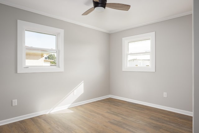 spare room featuring ornamental molding, hardwood / wood-style floors, and ceiling fan