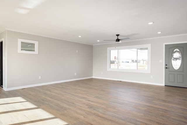 entrance foyer with crown molding, plenty of natural light, hardwood / wood-style floors, and ceiling fan