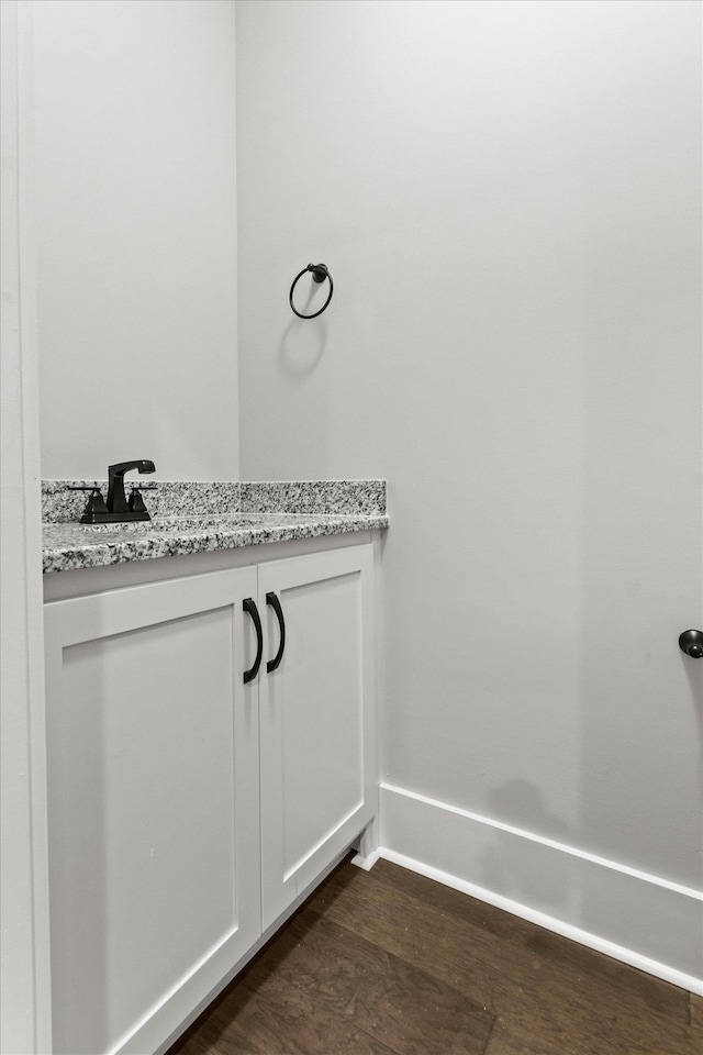 bathroom with wood-type flooring