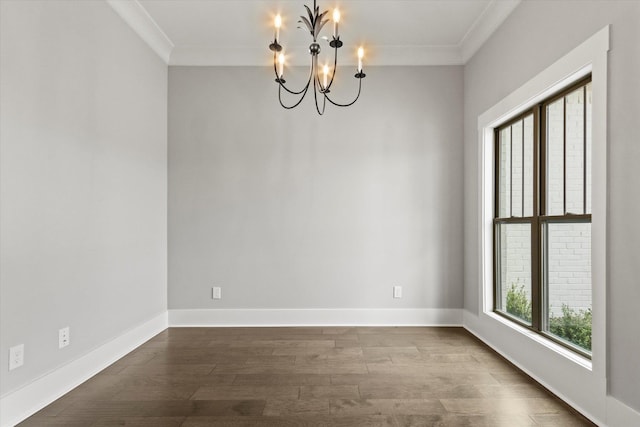 unfurnished room featuring hardwood / wood-style flooring, a chandelier, and ornamental molding