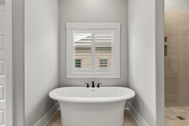 bathroom featuring separate shower and tub