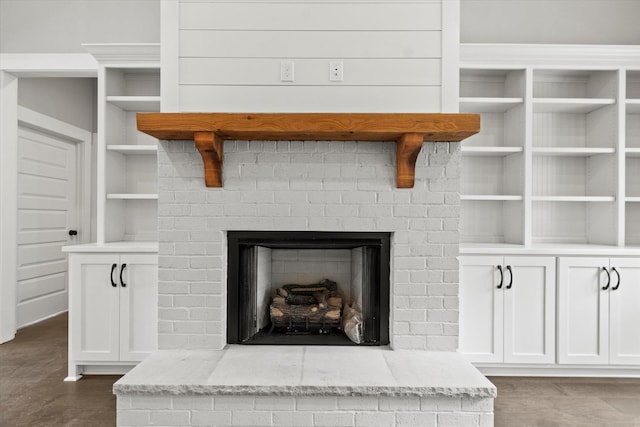 interior details with a brick fireplace