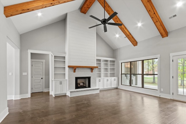 unfurnished living room featuring ceiling fan, dark wood-type flooring, high vaulted ceiling, and a brick fireplace