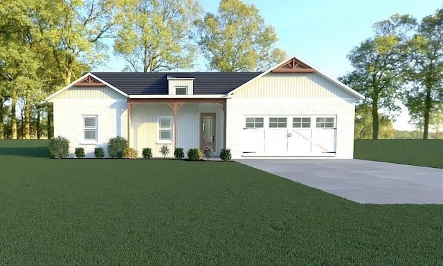 view of front of house featuring a garage and a front lawn