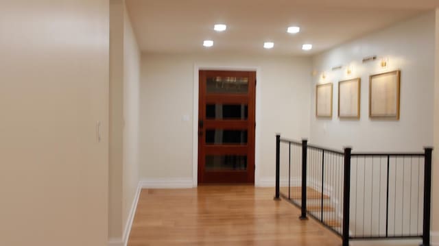 hallway with light wood-type flooring