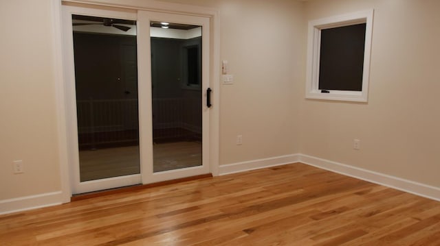 spare room with ceiling fan and light hardwood / wood-style flooring