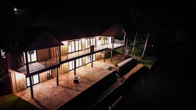 back house at twilight with a patio