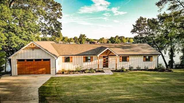 modern inspired farmhouse with a front lawn and a garage