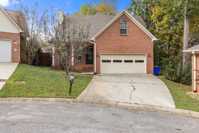 front of property featuring a front lawn and a garage