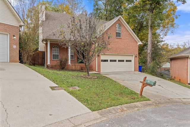 view of front property with a front yard and a garage