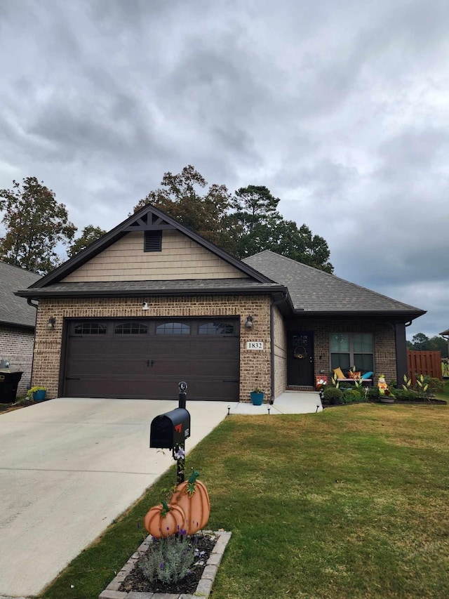 view of front of house with a garage and a front yard